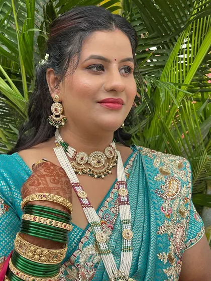 A close-up of the makeup, showing the flawless base and defined eyes.