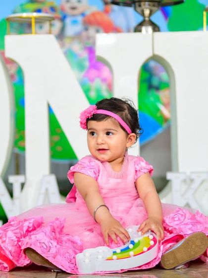 A vibrant 'Minions' themed birthday party, with yellow and blue decor, character cutouts, and fun props, creating a mischievous and joyful atmosphere.