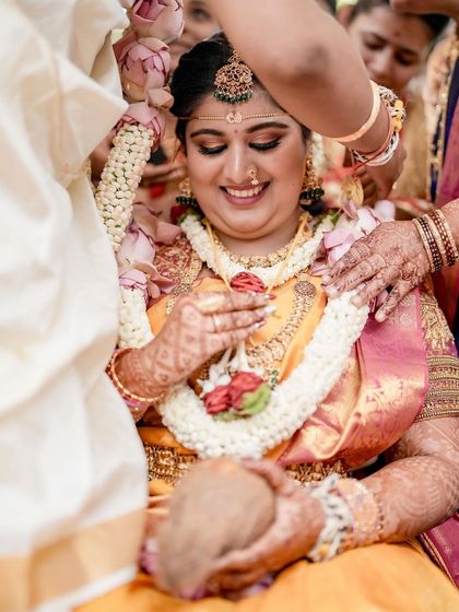 A beautiful, happy bride during her wedding ceremony. The decor and rituals all come together to create these moments of pure, unadulterated joy.