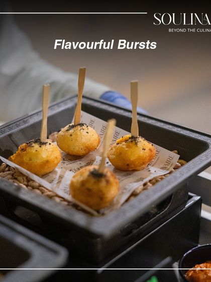 Flavourful bursts of dahi kebab, served on a bed of grains and presented on skewers. A delightful and easy-to-eat appetizer for any event.