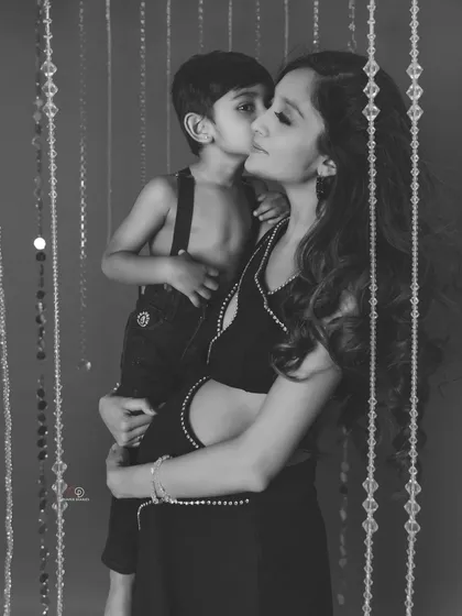 Another beautiful black and white shot from the same session. The way her son kisses her cheek is a memory she will cherish forever.