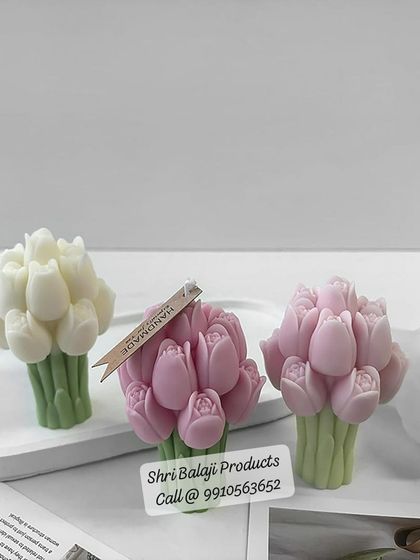 My tulip bouquet candle mold is perfect for creating elegant floral pieces. This image shows three finished candles, one with a "Handmade" tag, illustrating a nice packaging touch.