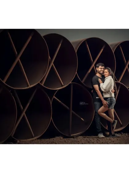 Using an industrial location with these large pipes created a unique and modern backdrop for this couple's portrait. It shows that any location can be made romantic.