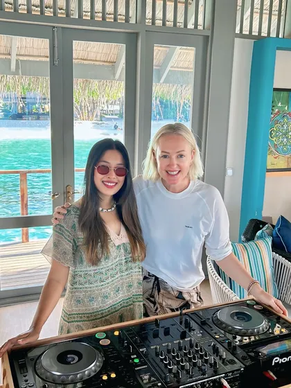 Another happy moment with a guest by the beautiful turquoise waters of the Maldives, right next to my DJ setup.