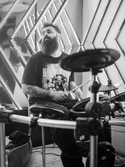 A live drummer laying down the beat alongside my tracks. This fusion of DJing and a live band creates an incredible, high-impact performance.