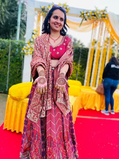 Another shot of the happy client at the outdoor mehndi event. The natural light brings out the beauty of her henna.