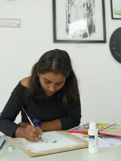 A student in our CFA program practices her watercolor skills, learning about washes and layering.