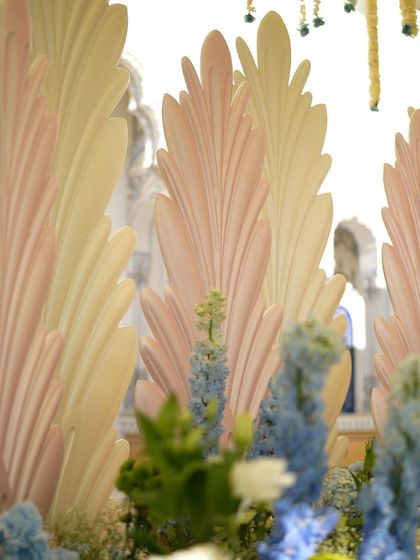 A close-up of the pastel pink and cream feather-inspired panels.