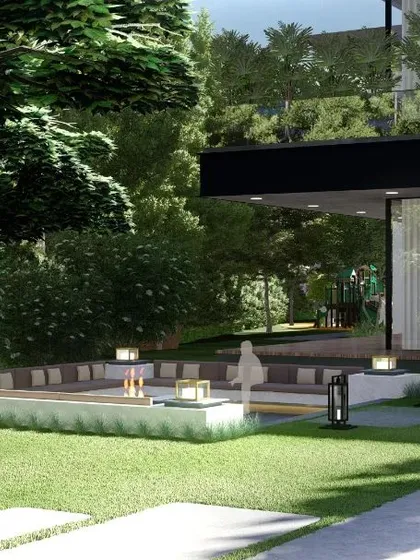 A perspective of a sunken seating area from the lawn, showing its integration with the main house and surrounding trees. The design uses changes in level to create dynamic and interesting garden layouts.