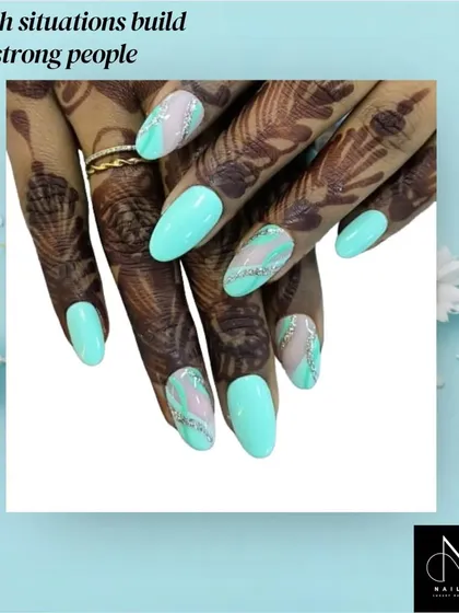 A fresh and modern design that looks stunning with bridal henna. This set features bright aqua nails with silver glitter and abstract marble accent nails.