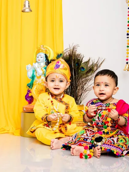 A beautiful Radha and Krishna duo. This sibling photoshoot for Janmashtami captures a sweet moment between a brother and sister in their festive outfits.