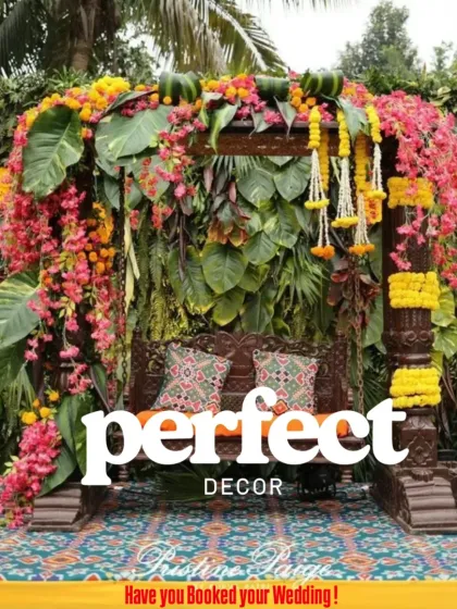For pre-wedding functions like Mehendi or Haldi, I love creating vibrant, joyful spaces. This traditional wooden jhoola, heavily decorated with marigolds and bougainvillea against a lush green wall, is a perfect photo spot.