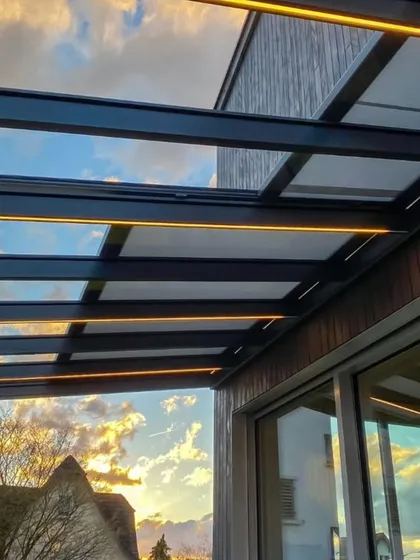 We often integrate ambient lighting into our pergola designs. This close-up shows LED strips fitted along the rafters, providing subtle illumination that transforms the outdoor space into a usable and atmospheric area after sunset.