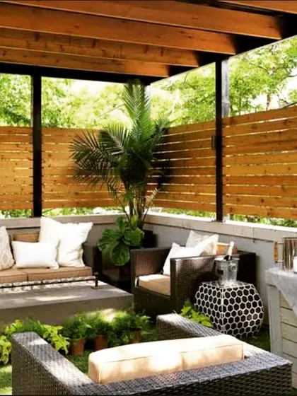 For this project, we used wooden privacy screens and comfortable wicker furniture to create an intimate and cozy seating area. The surrounding greenery makes it feel like a private retreat, even in a residential neighborhood.