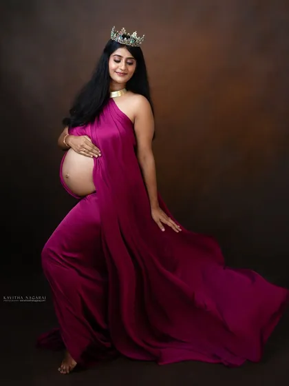 An elegant maternity portrait of a mother-to-be wearing a crown. This image celebrates the queen that every expecting mother is.