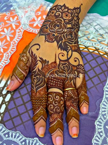 A single-hand design with a mix of roses and traditional finger patterns.