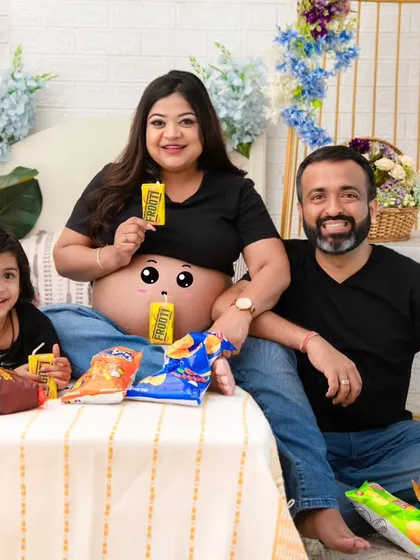 Maternity sessions can be playful and fun too. This family wanted to capture their real-life cravings and joyful chaos, and the result is a portrait filled with laughter and personality. It’s a beautiful reminder that this journey is about celebrating your unique family story.