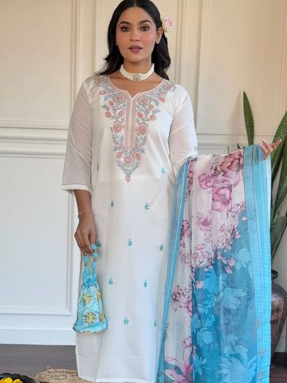 This off-white viscose chanderi kurta is a classic. The delicate embroidery and printed floral dupatta in shades of blue add a touch of color and grace.