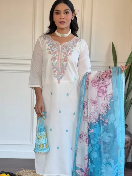 This off-white viscose chanderi kurta is a classic. The delicate embroidery and printed floral dupatta in shades of blue add a touch of color and grace.