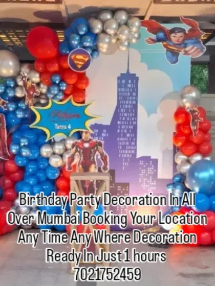 I design action-packed superhero themes for your child's special day. This setup features an Avengers theme with Iron Man and Superman, a city skyline backdrop, and a large light-up number '4' to make the celebration unforgettable.