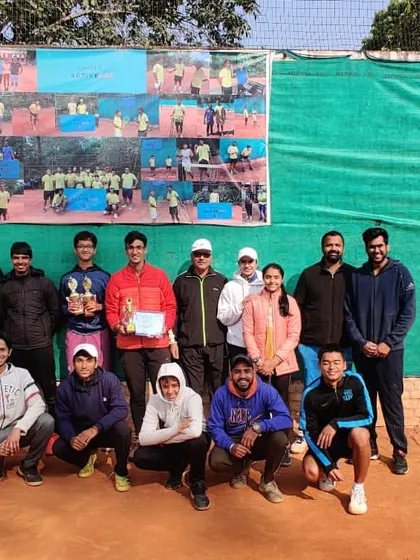 A full team photo celebrating the achievements of players like Riddhiman Ojha and Paranjay from a successful tournament week.