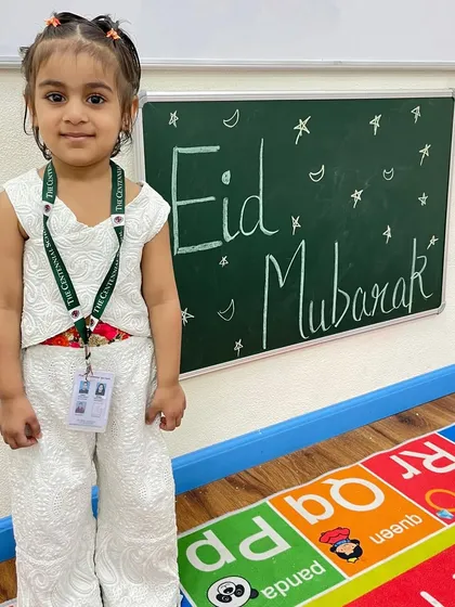 This little girl is dressed beautifully for our Eid celebration, posing with a proud smile. We encourage children to celebrate all festivals with enthusiasm.