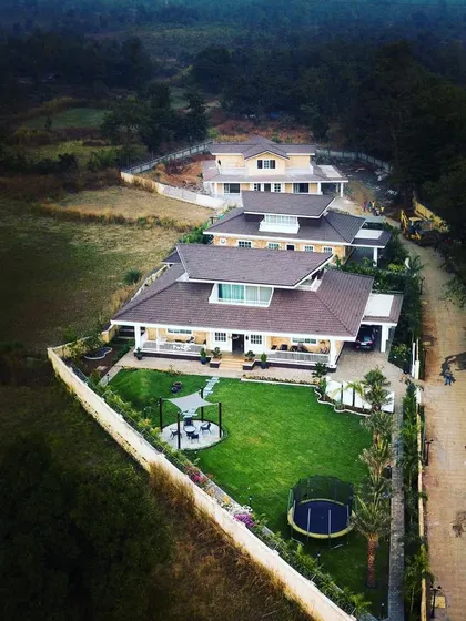 This aerial view captures the scale of a residential development we landscaped. Our planning ensures that each villa enjoys its own private green space, including a lawn, poolside planting, and boundary gardens, creating a cohesive and green community.