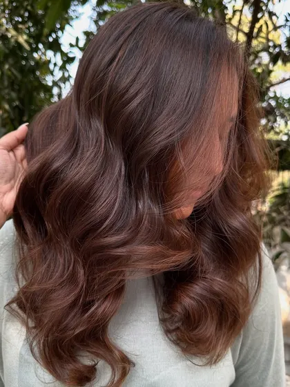 This is my 'Chocolate Pecan Dream' creation. We started with a faded base and gave her this incredibly rich, warm brown with delicate pecan highlights. The result is a glossy, healthy-looking color that’s perfect for any season.