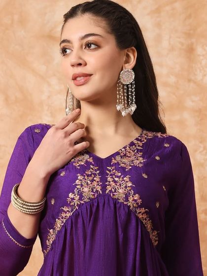 A wine-colored kurta pant set with a flattering A-line silhouette. The thread embroidery on the yoke adds a beautiful detail.