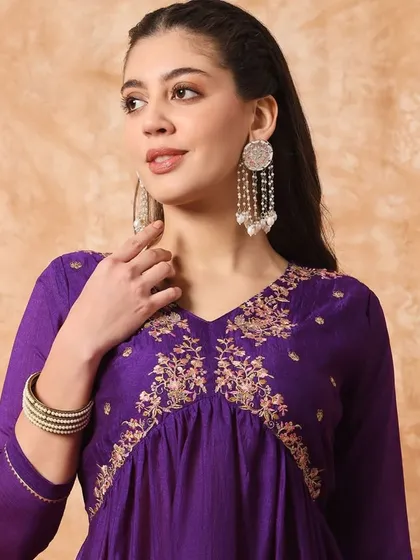 A wine-colored kurta pant set with a flattering A-line silhouette. The thread embroidery on the yoke adds a beautiful detail.