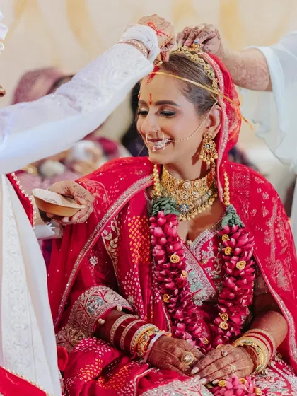 Beyond the glam, it’s about creating calm and confidence. Here are some beautiful moments from Surbhi and Rishabh's wedding, where her makeup stayed flawless through all the ceremonies.