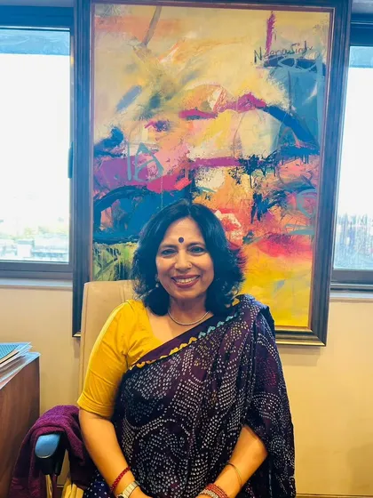 A quiet moment in my office. The art behind me is a source of inspiration, reminding me of the creativity and passion required in the legal profession.