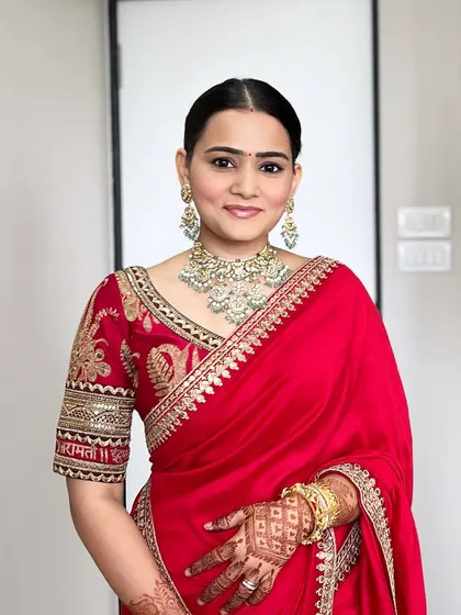 The full look, showcasing the stunning Sabyasachi saree and the understated, clean makeup. It's a perfect example of timeless beauty.