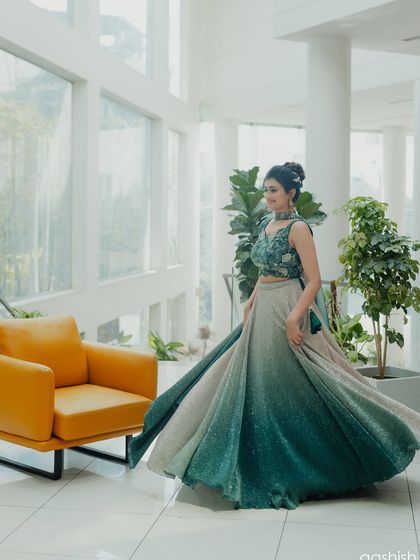 A beautiful twirling shot that shows the flow and movement of the lehenga, creating a dynamic and joyful image.