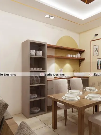 A simple and functional dining area designed for an apartment. The space includes a compact dining table, open shelving for easy access, and a dedicated crockery unit, all tied together with warm, neutral tones.