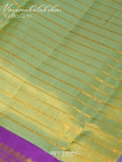 The body of the tissue saree features elegant horizontal zari lines, adding a subtle shimmer.