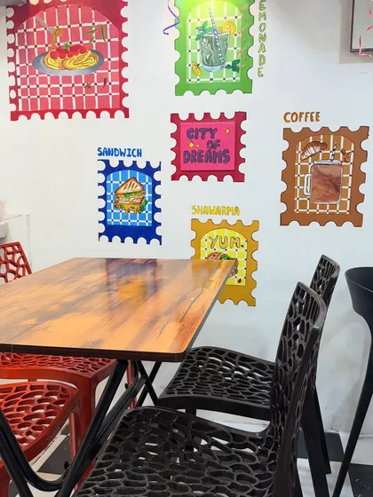 The interior of my new Thane outlet, featuring colourful wall art and comfortable seating. I'm now serving across 6 locations.