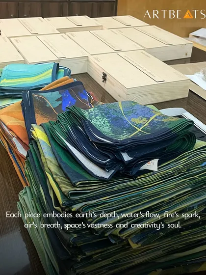 We believe craftsmanship can exist at any scale. Here, we are preparing a large corporate order of our 'Panchabhuta' themed scarves, each one folded with care. Every piece receives the same attention, whether you need ten gifts or three hundred.