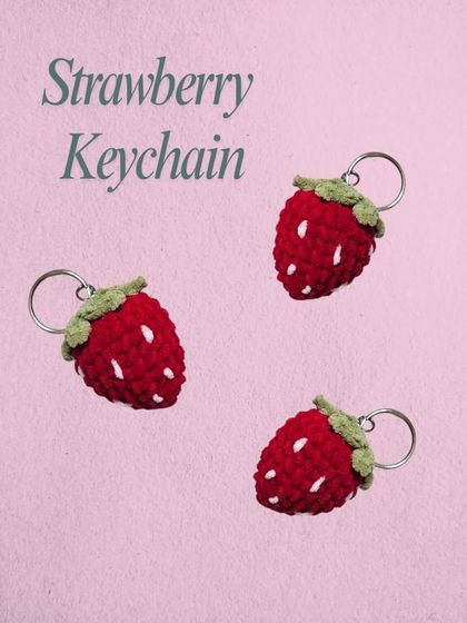 A trio of my handmade strawberry keychains. I make these with a little bit of stuffing to make them plump, and the white "seeds" are embroidered on by hand. They are a sweet and simple accessory.