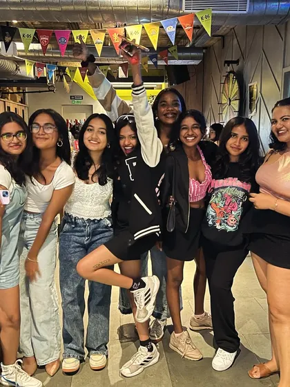 The whole girl squad came out for karaoke night, ready to sing, dance, and make some noise.