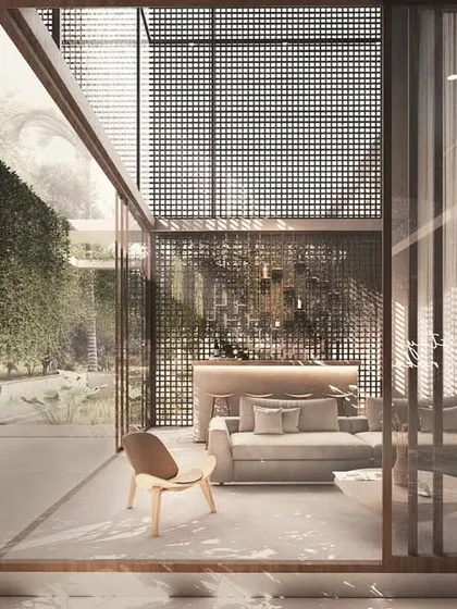 This view highlights the double-height bar and entertainment space in the House of Veils. Filtered light from architectural screens creates a soft, inviting ambiance, perfect for social gatherings.