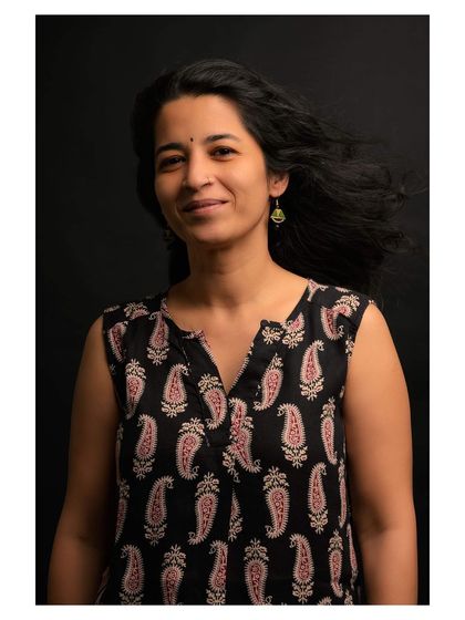 A portrait from the same series, with subtle movement in the hair adding a dynamic touch.