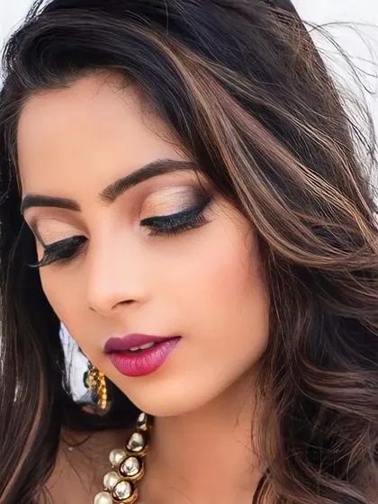 A close-up of the eye makeup from the photoshoot. This showcases the detailed cut-crease eyeshadow work with a touch of shimmer, perfect for a high-fashion or glamour look.