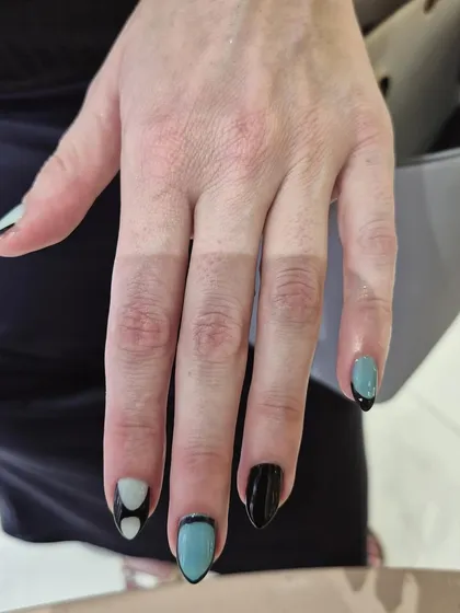 A bold, graphic look with geometric shapes in black, white, and teal. This shows our versatility in creating modern, edgy designs.