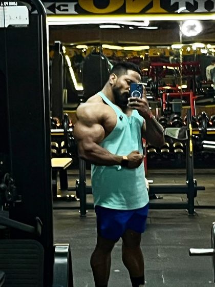 A gym selfie showing the arm and shoulder pump after a good workout.