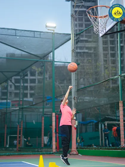 A young player executes a perfect jump shot. Our training helps athletes develop proper form and confidence to take and make important shots.