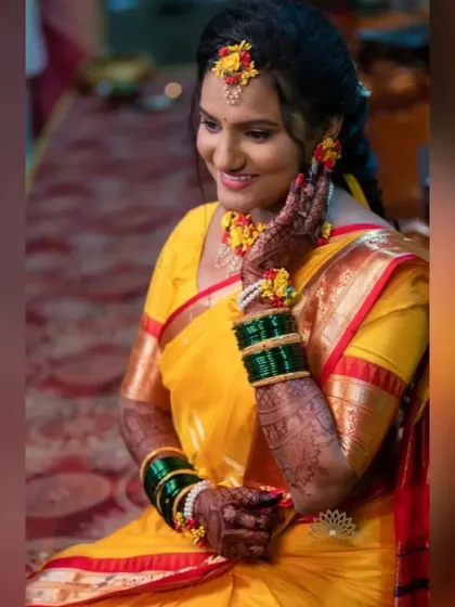Another beautiful shot from the haldi ceremony. The bride's smile and her beautiful mehndi are the highlights of this happy moment.