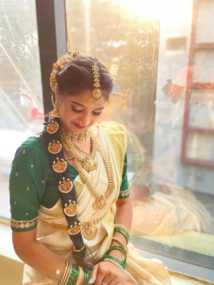 A perfect example of a traditional South Indian bridal look created by one of my students. You will learn to master intricate details, from the elaborate hair adornments to the radiant, golden-toned makeup that defines this classic style.