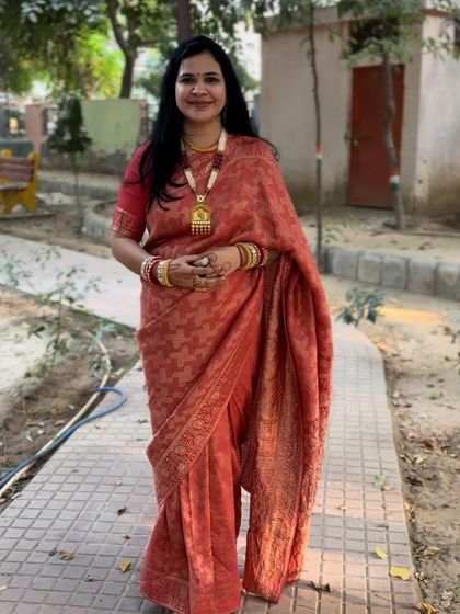 This orange silk saree was my choice for a festive occasion. The rich color and traditional fabric make it a classic choice. Paired with a temple jewellery necklace, it creates a very traditional and elegant look.