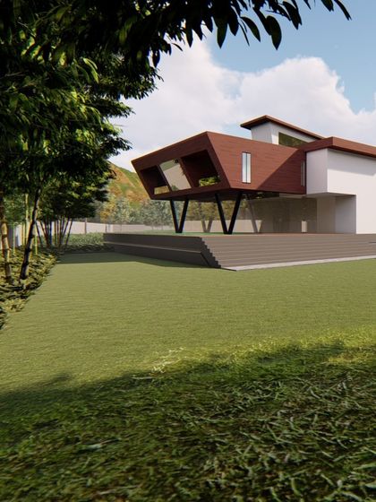 The cantilevered section of this home is supported by striking V-shaped columns, creating a covered outdoor space below. This view from the garden highlights the building's dynamic relationship with the landscape.